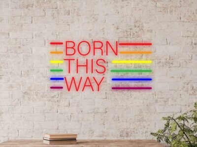 "Born This Way" neon sign with vibrant LED lighting, creating a bold and inspiring statement piece for bedrooms, events, salons, retail spaces, and modern interiors.